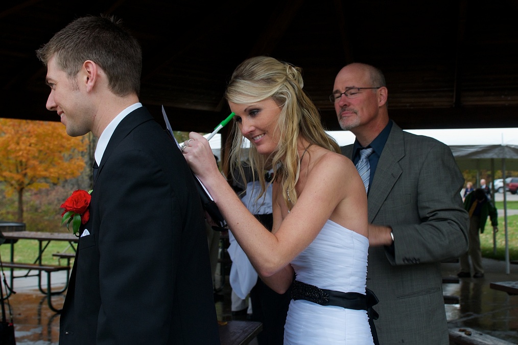 The wedding ceremony concludes with the signing of the marriage licence place at F.W. Kent Park in Johnson County, Iowa.