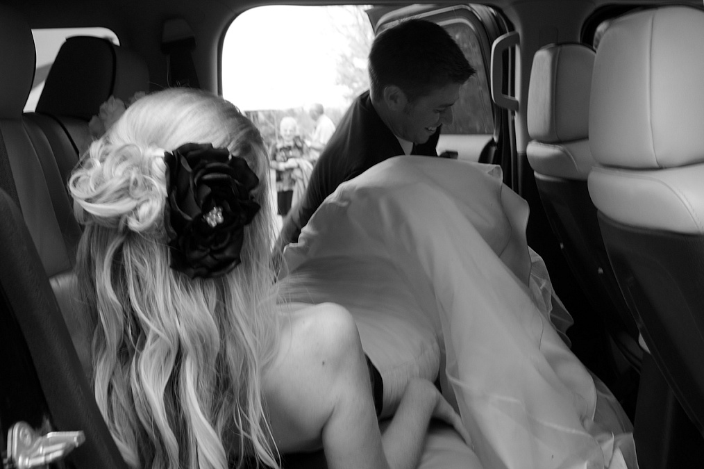 The couple departs after their wedding ceremony at F.W. Kent Park in Johnson County, Iowa.